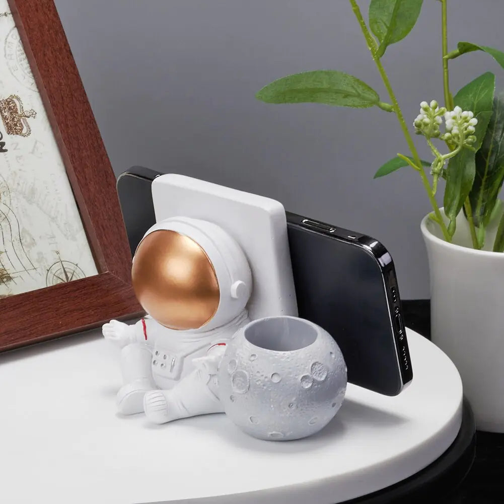 Soporte para teléfono móvil con forma de astronauta